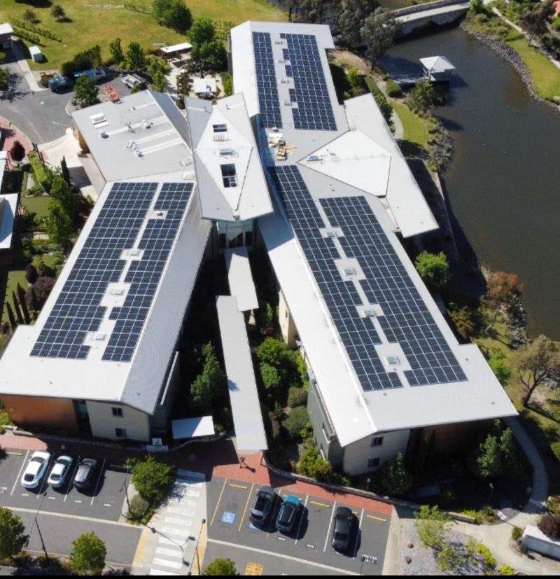 Aerial of Goodwin Monash rooftop solar beside water